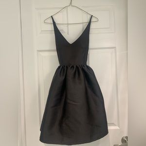 Short puffy black dress with crisscross straps